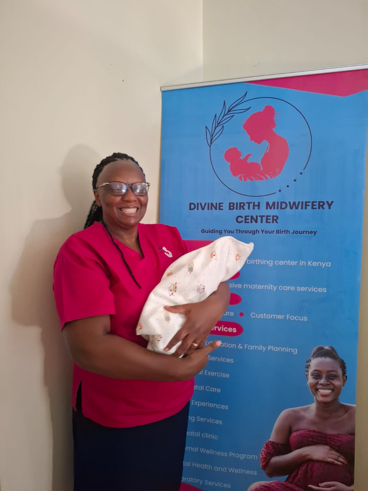 A Divine Birth midwife placing a newborn into her mother's arms