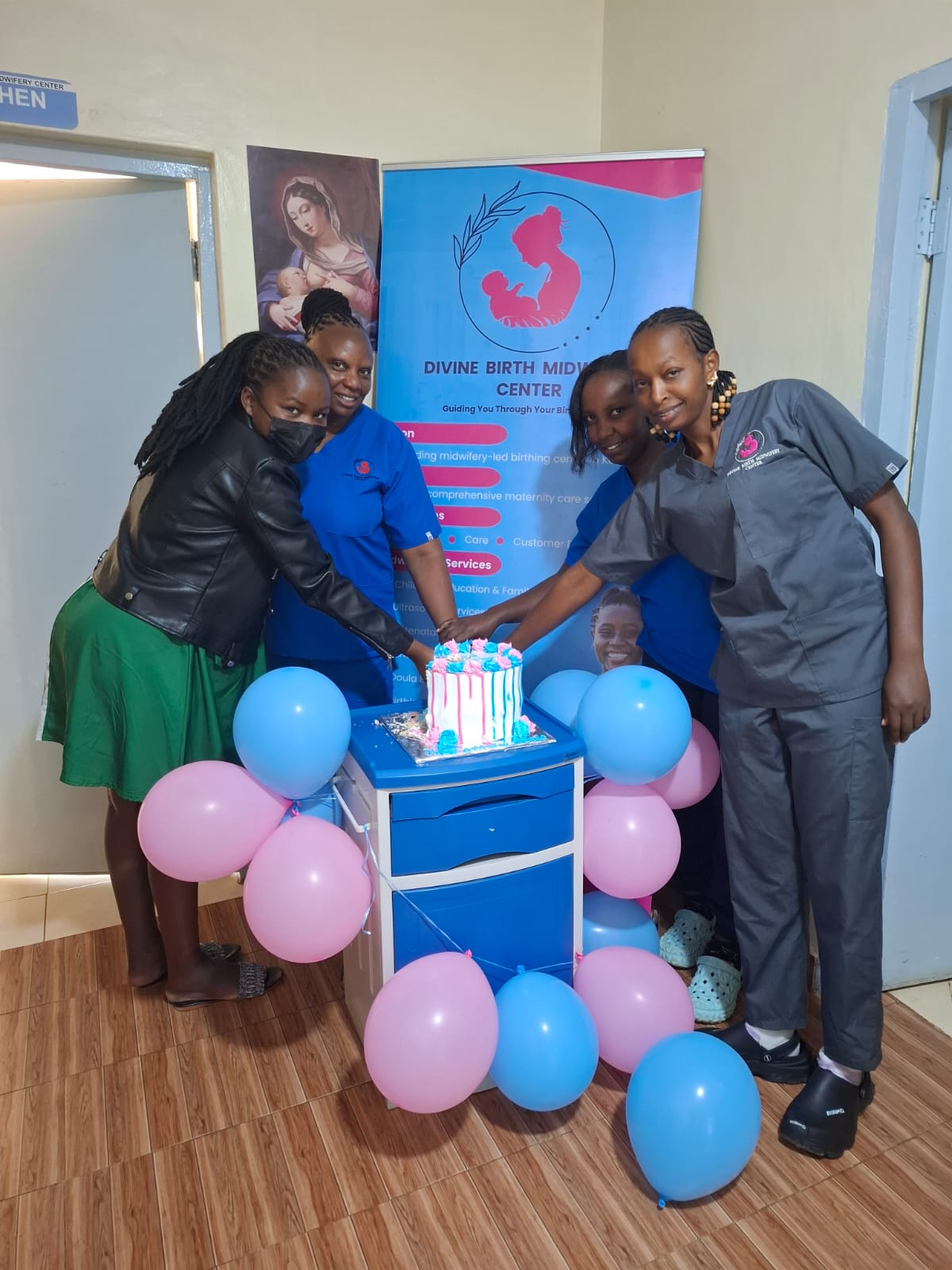 The Divine Birth team celebrating together at the centre